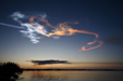 Cloud formations after the launch of Space Shuttle Discovery reflecting the first sun light of the day